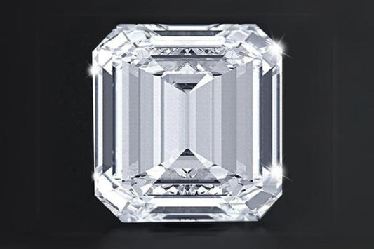 Close-up of a clear, sparkling asscher-cut diamond on a black background.