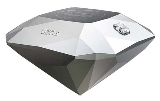 Close-up of a diamond-shaped object with the number '2020' engraved, featuring a small diamond embedded on one side, showcasing a unique geometric design.
