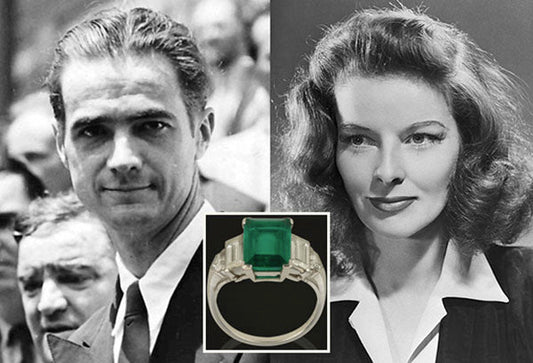 Black-and-white photo of Howard Hughes and Katharine Hepburn, with a close-up of Katharine's emerald-cut emerald engagement ring. The iconic ring features a large green emerald set in a platinum band, symbolizing the couple's famous relationship.