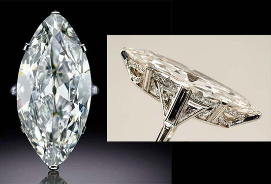 Large marquise-cut diamond ring shown from two angles, featuring intricate side detailing and sparkling clarity.