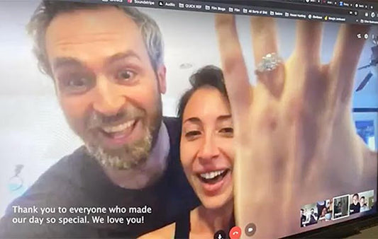 Happy couple showing engagement ring during a virtual call, with a thank you message to friends and family for making their day special.
