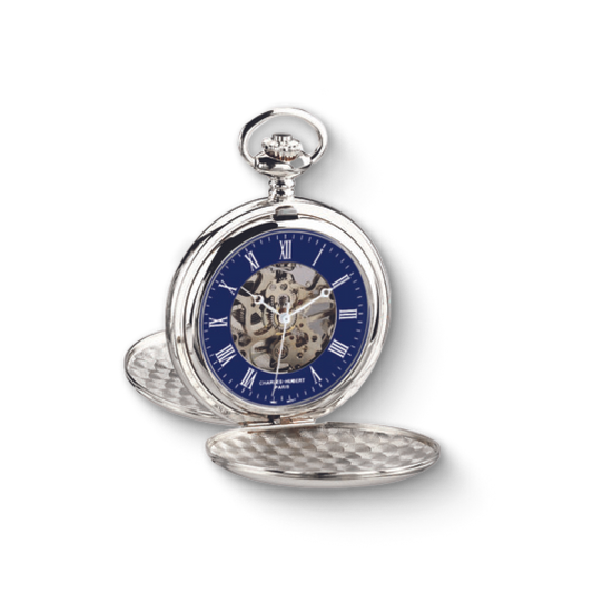 Close-up of a Charles Hubert silver-plated double full hunter mechanical pocket watch with a blue skeleton dial, Roman numerals, and visible gears.