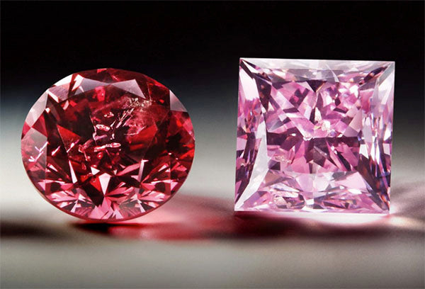 Two precious pink diamonds, one round and one square, with sparkling facets on a dark background, showcasing their brilliant cut and vibrant color.