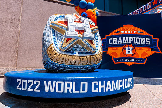 2022 Houston Astros World Series Championship ring display at the stadium, featuring a large replica with the team logo and '2022 World Champions' text.