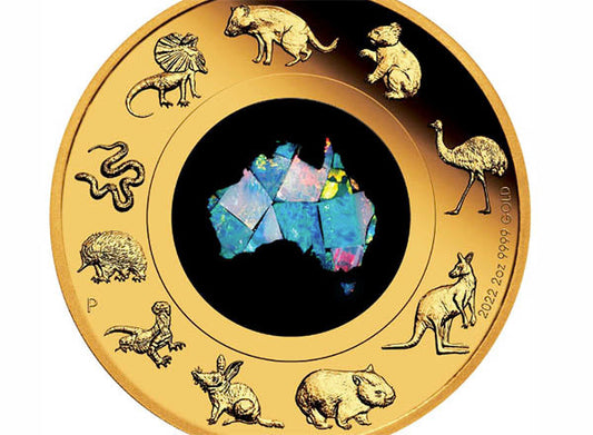Australian gold coin featuring opal inlay shaped like the continent and surrounded by native animals such as kangaroo, emu, wombat, and koala – 2022 two-ounce 99.99% pure gold collector coin.