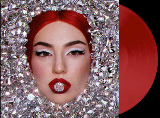 Close-up of a woman with red hair, bold makeup, and a diamond-studded lip ring, surrounded by sparkling diamonds, with a red vinyl record beside her. The image is styled to promote an album cover.