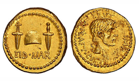 Ancient Roman gold coin featuring the 'Eid Mar' inscription, with crossed swords and helmet on one side and a portrait of Brutus on the other.