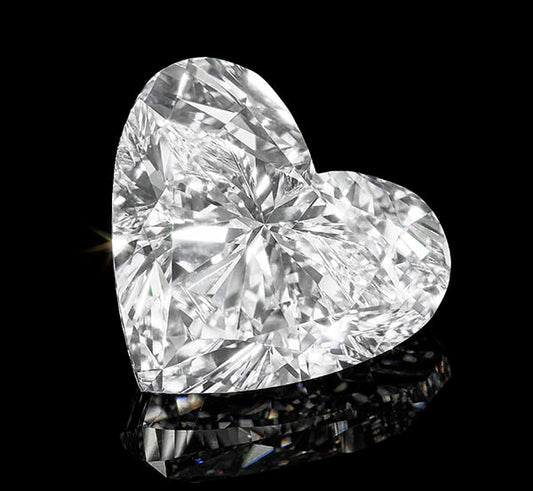 Close-up of a sparkling heart-shaped diamond on a black background, showcasing its brilliant cut and clarity.