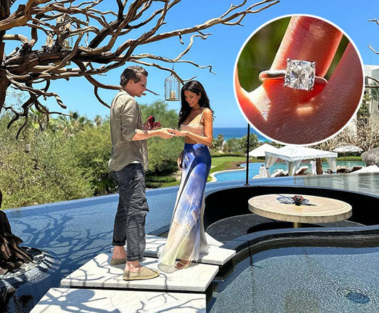 Couple getting engaged outdoors by a pool, with a close-up of the engagement ring on the woman's finger featuring a square diamond.