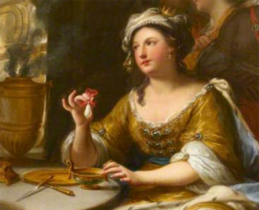 Portrait of a woman from the 17th century, wearing a golden gown and a headpiece, holding a flower while seated at a table with a bowl and utensils, in a classical painting style.