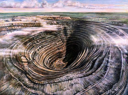 Aerial view of a large open-pit mine with concentric layers and excavation machinery, showcasing the vast scale of the mining operation.