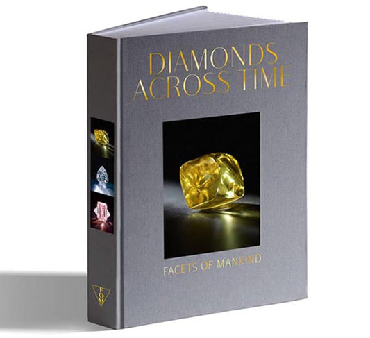 Cover of the book 'Diamonds Across Time: Facets of Mankind' featuring an image of a yellow diamond with additional diamond images on the sides.