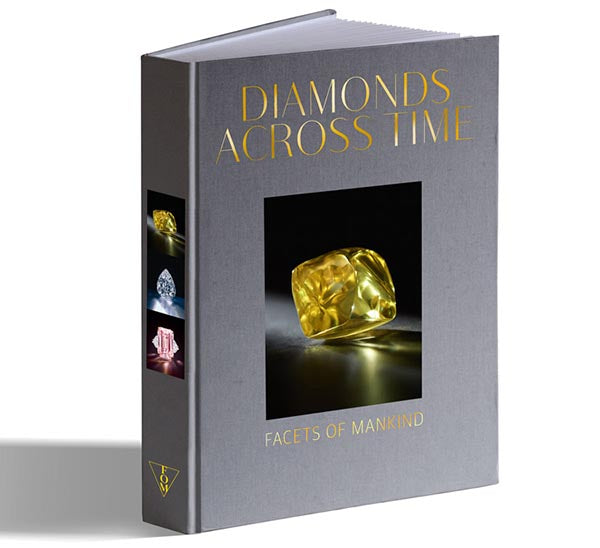 Book titled 'Diamonds Across Time: Facets of Mankind' with a cover featuring a close-up of a yellow diamond. The book's design includes additional images of various diamonds on the left side, highlighting the elegant and luxurious theme.