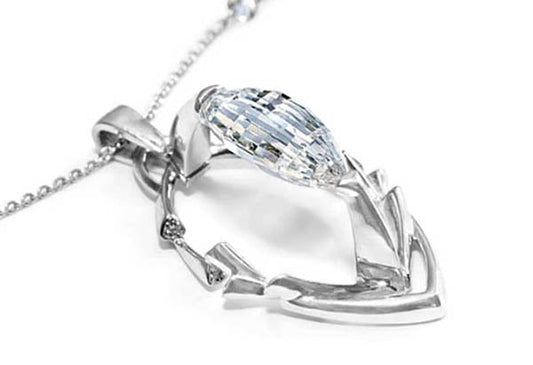 Close-up of a white gold necklace featuring a marquise-cut diamond pendant in a unique arrowhead-inspired design, perfect for elegant and modern jewelry lovers.