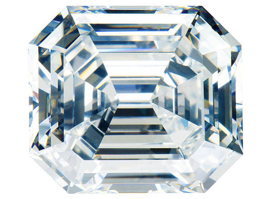 Close-up image of a radiant cut diamond with multi-faceted edges, showcasing its clarity and brilliance against a light background.