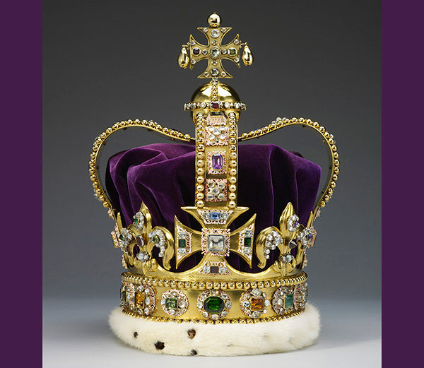 Golden royal crown with purple velvet lining, adorned with diamonds, emeralds, and other colorful gemstones, featuring a cross at the top and a fur trim at the base.