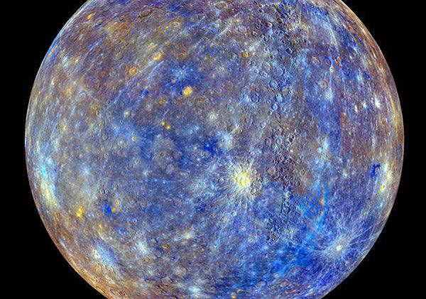 Close-up view of the planet Mercury showing its rocky surface and distinct craters in high-resolution, with vivid blue and yellow hues captured by the space probe.