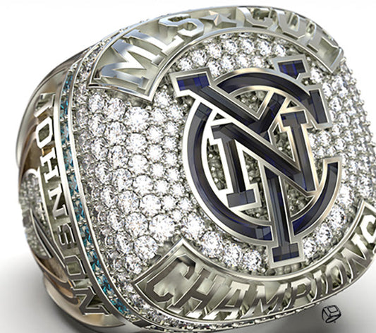Close-up of a detailed MLS Championship ring with diamonds, featuring the New York City FC logo and the name 'Johnson' engraved on the side.