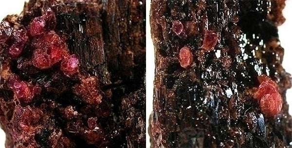 Close-up image of rough Tourmaline gemstone crystals with pinkish-red color embedded in dark matrix, highlighting the intricate texture and natural formation of the minerals.