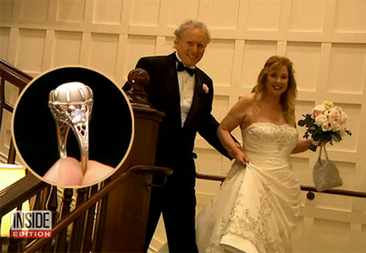 Bride and groom smiling while walking down the stairs, with the bride holding a bouquet and wearing a wedding dress. Inset shows close-up of the bride's engagement ring.