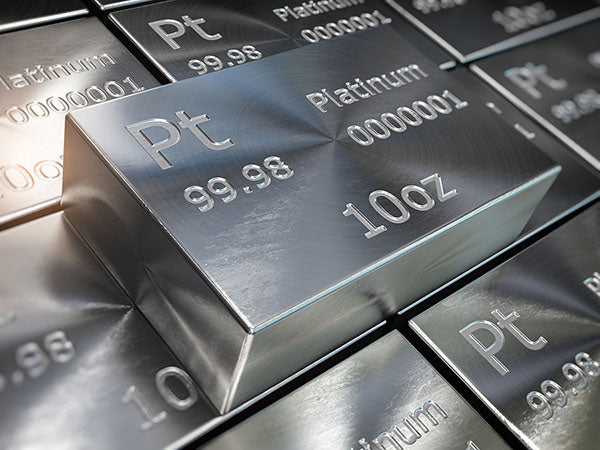 Close-up image of platinum bars, stamped with 'Pt,' '99.98,' 'Platinum,' and '10oz,' showcasing their weight and purity in high detail.