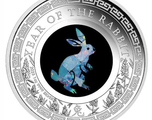 2023 Year of the Rabbit silver coin featuring a holographic rabbit design in the center, surrounded by intricate floral details and the text 'Year of the Rabbit'.