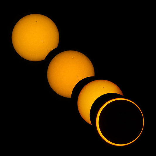 Sequence of a solar eclipse showing the moon gradually covering the sun, from partial to full eclipse, against a dark sky.