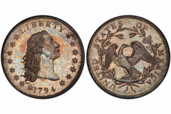 Close-up of a 1794 Liberty silver coin showing a profile of Lady Liberty on the front, with stars surrounding her head. The reverse side displays an eagle within a laurel wreath, with 'UNITED STATES OF AMERICA' inscribed.