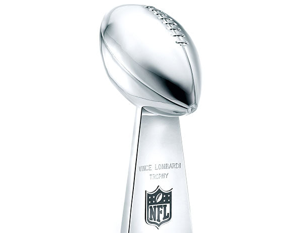 Vince Lombardi Trophy, the prestigious NFL championship trophy, featuring a football atop a silver pedestal engraved with the NFL logo.
