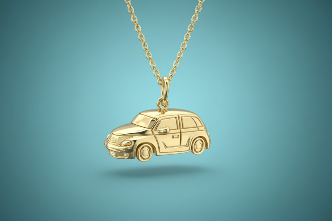 A gold PT Cruiser car pendant hanging from a gold chain, displayed against a smooth teal gradient background.